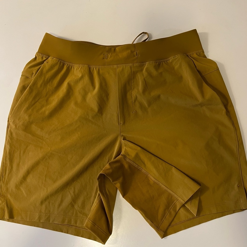 Lululemon men’s mustard colored shorts. Size L.